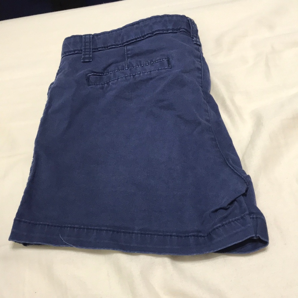 Two navy blue, one white, one blue jean